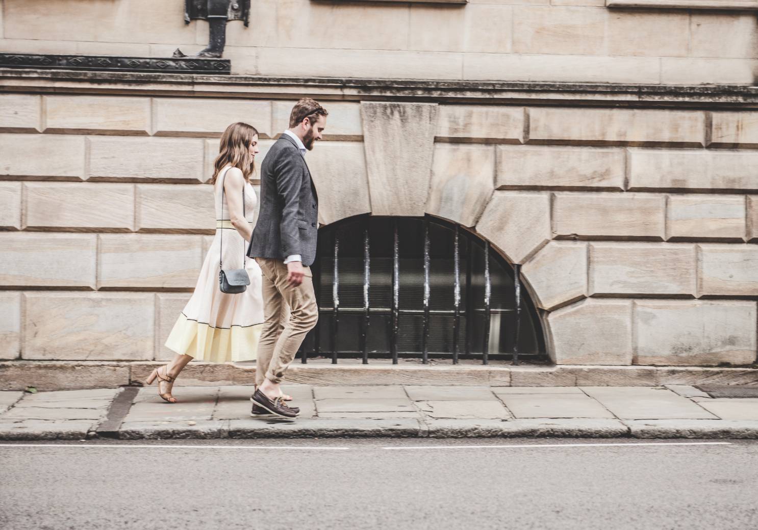 a couple walking down a street